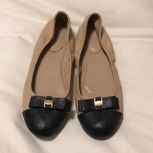 Black snake skin tipped flats